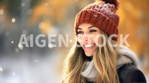 A beautiful happy woman, smiling, with a winter cap in a snow environment