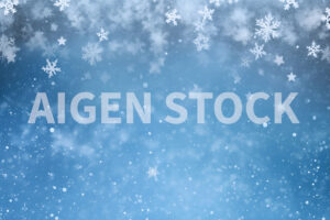 A christmas blue background with some snow flakes with large copy space