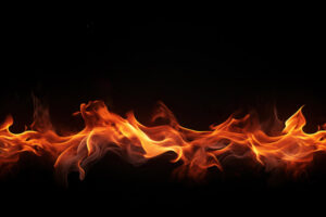 A fire line with flames in a black background